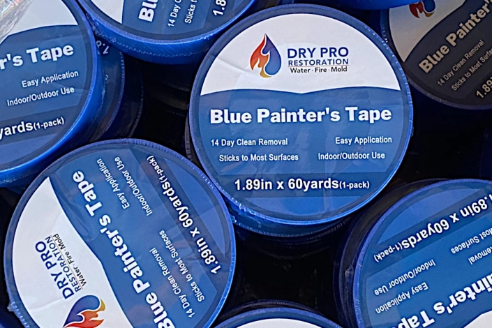 Water Damage Restoration in New Orleans. Dry Pro Restoration Blue Painter's Tape. Flood Damage of Garage.