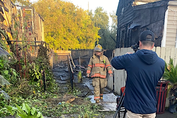House Damaged by Fire in the Bywater. Emergency Crews on the Scene.